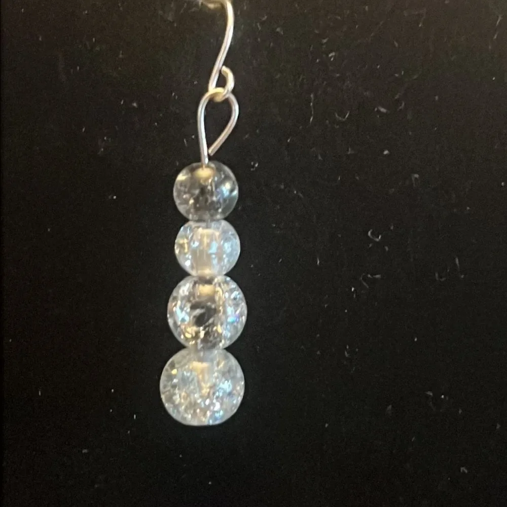 Handcrafted silver tone and glass bead earrings.